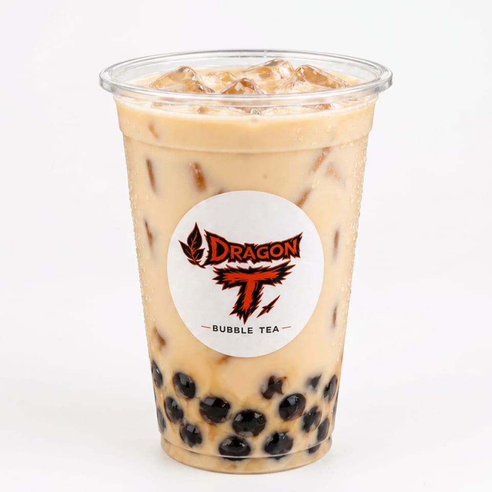 Iced milk bubble tea with black tapioca pearls in a Dragon T Bubble Tea branded cup.