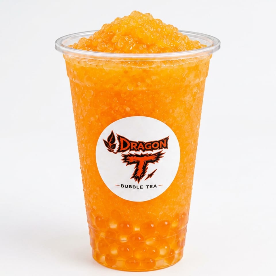 Orange slush bubble tea topped with icy pearls and orange tapioca balls, served in a Dragon T Bubble Tea cup.